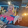 Zander joined the competition — help win amazing prizes! baby, blanket, casual, child, cozy, curious, decorations, expression, face, furniture, hand, indoor, lamp, lighting, person, portrait, refrigerator, room, shelf, string_lights