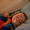 Zander is registered to the contest to win money with this photo: baby, bedroom, blanket, child, clothing, comfort, cozy, cushion, face, indoors, infant, nap, pacifier, peaceful, person, pillow, rest, sleeping, soft, warm