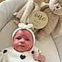 Mya a rejoint le concours — aidez-le/la à gagner de superbes lots ! baby, infant, one_month, plush_toy, stuffed_animal, teddy_bear, lamb, white_hat, heart_pattern, bassinet, blanket, soft_toys, wooden_sign, cute, newborn, portrait, indoor, cozy, baby_clothes, milestone
