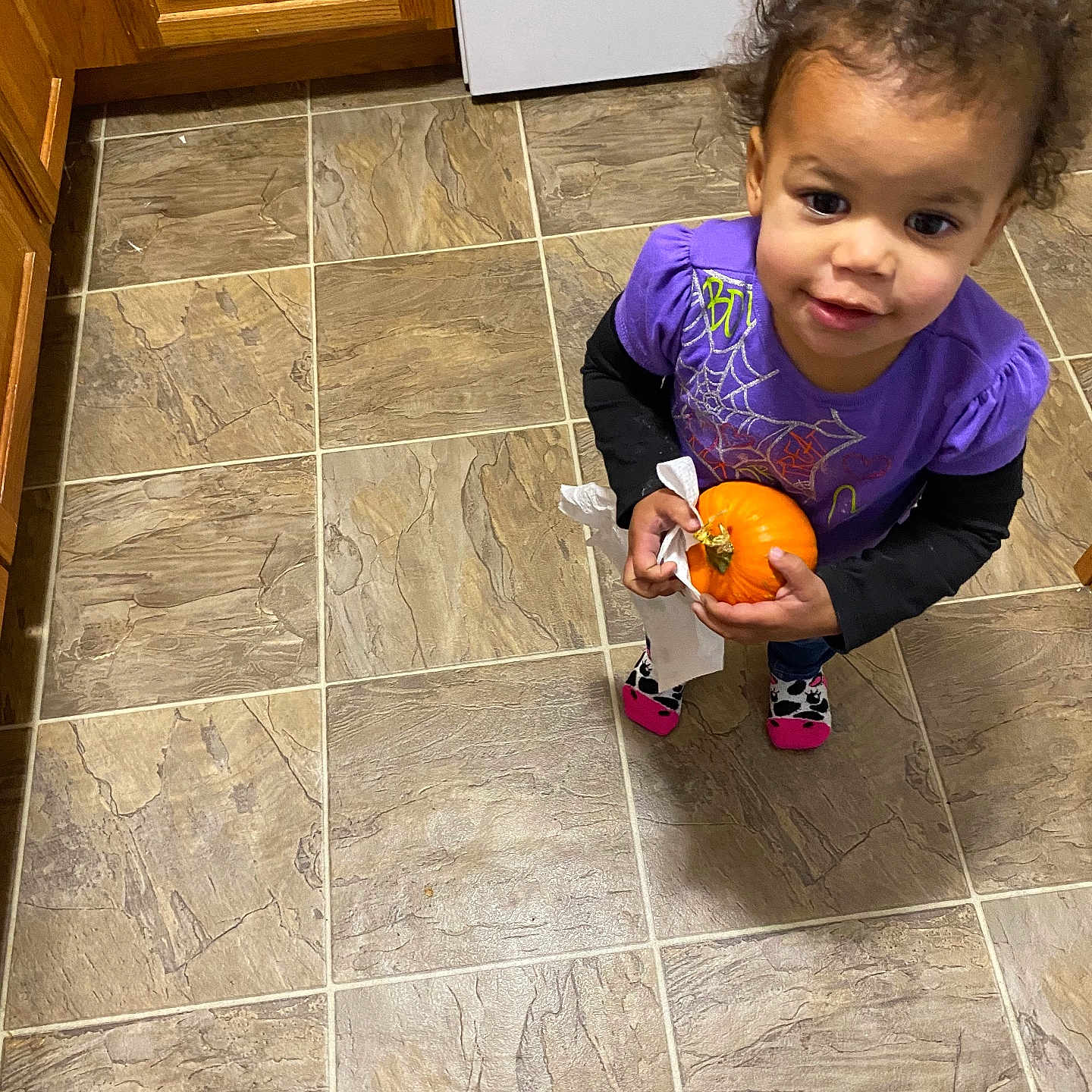 Everlee is registered to the contest to win money with this photo: cabinet, child, clothing, face, female, food, footwear, furniture, girl, hardwood, head, indoors, interiordesign, person, photography, portrait, produce, shoe, tile, wood