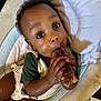 Jaleil joined the competition — help win amazing prizes! baby, child, face, hands, food, meat, bone, highchair, cushion, clothing, curly_hair, eating, messy, indoor, person, infant, closeup, cute, feeding, seat