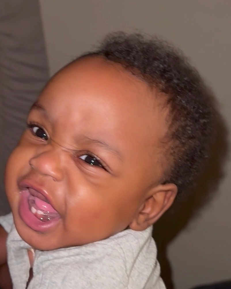 Jaleil joined the competition — help win amazing prizes! baby, face, expression, mouth, teeth, drool, skin, hair, head, infant, closeup, child, person, portrait, cute, young, emotion, scrunched_face, indoor, clothing