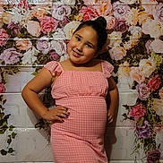 Sarah is registered to the contest to win money with this photo: child, clothing, dress, face, fashion, female, flower, flowerarrangement, flowerbouquet, formalwear, girl, happy, head, person, petal, photography, plant, portrait, rose, smile