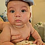 Devin is registered to the contest to win money with this photo: baby, child, face, cap, hand, skin, cute, expression, infant, portrait, closeup, indoor, support, pout, curious, chubby, person, fingers, soft, cushion