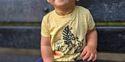 Devin is registered to the contest to win money with this photo: toddler, child, bench, outdoor, smiling, yellow_tshirt, blue_shoes, shorts, nature, park, happy, sitting, cute, face, person, footwear, casual_clothing, daylight, expression, young_child