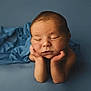 Tom participe au concours pour gagner de l'argent avec cette photo : newborn, baby, infant, sleeping, pose, hands, face, blue, cloth, soft, portrait, studio, photography, cute, peaceful, child, skin, head, resting, tender