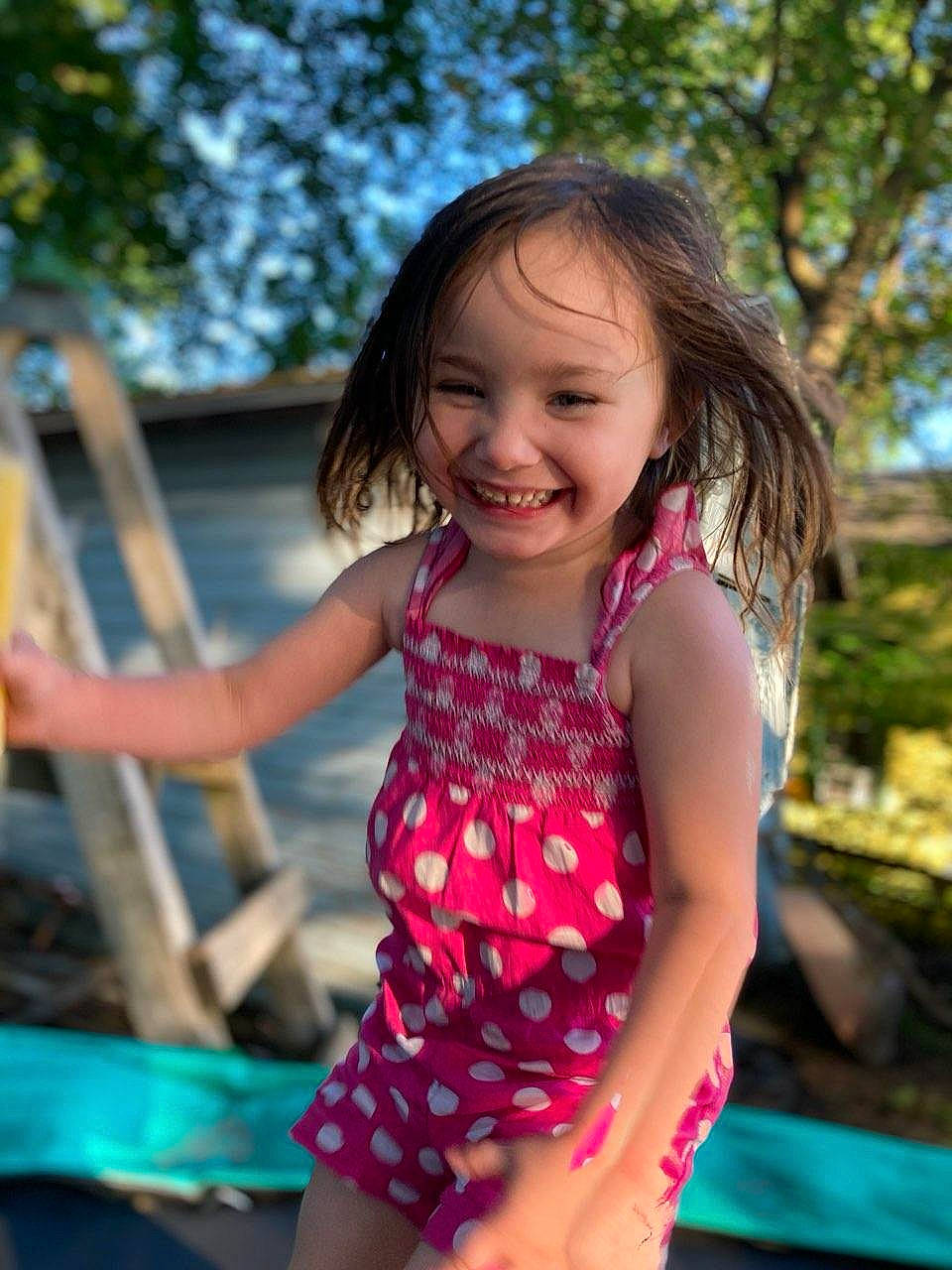 Gabbriella joined the competition — help win amazing prizes! dress, eye, face, facial_expression, fun, grass, happy, human_body, joy, leisure, people, people_in_nature, person, plant, shorts, skin, smile, thigh, toddler, tree