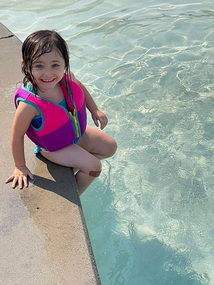 Gabbriella is registered to the contest to win money with this photo: aqua, azure, barefoot, body_of_water, foot, fun, happy, head, human_body, human_leg, joy, leg, leisure, people_in_nature, people_on_beach, person, recreation, smile, thigh, toddler