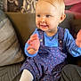 toddler, child, smiling, clapping, blue_dress, white_tights, pony_tail, indoor, couch, cushion, happy, person, baby, seat, home, portrait, cute, young_child, sitting, fabric