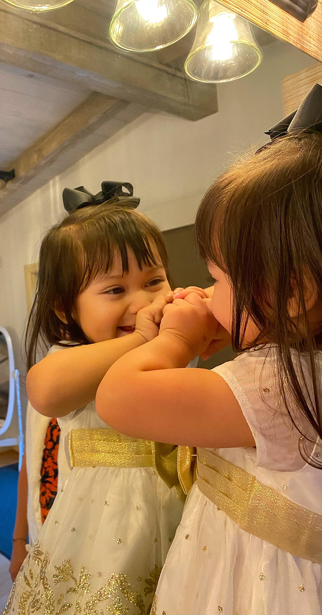 Elocin Grace is registered to the contest to win money with this photo: baby, blond, child, day_dress, dress, embellishment, event, fashion_accessory, fun, gesture, hair_coloring, happy, interaction, layered_hair, person, room, shoulder, skin, smile, toddler