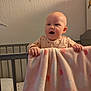 Maeve joined the competition — help win amazing prizes! baby, blanket, crib, child, heart_pattern, nursery, infant, pink, soft_lighting, cute, expression, grip, sleepwear, furniture, indoors, portrait, wall_texture, head, hands, room