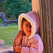 Jasmine Kaur joined the competition — help win amazing prizes! child, toddler, portrait, pink_coat, winter_clothing, hood, fluffy_trim, doorway, window, outdoor, garden, grass, trees, wood, sunlight, sitting, standing, face, smartphone_screenshot, home_screen