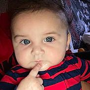 Alfonso Angelo joined the competition — help win amazing prizes! baby, child, face, blue_eyes, finger, drool, striped_clothing, red, navy_blue, curious, close_up, indoor, portrait, chubby_cheeks, person, tapestry, decor, expression, thinking, young