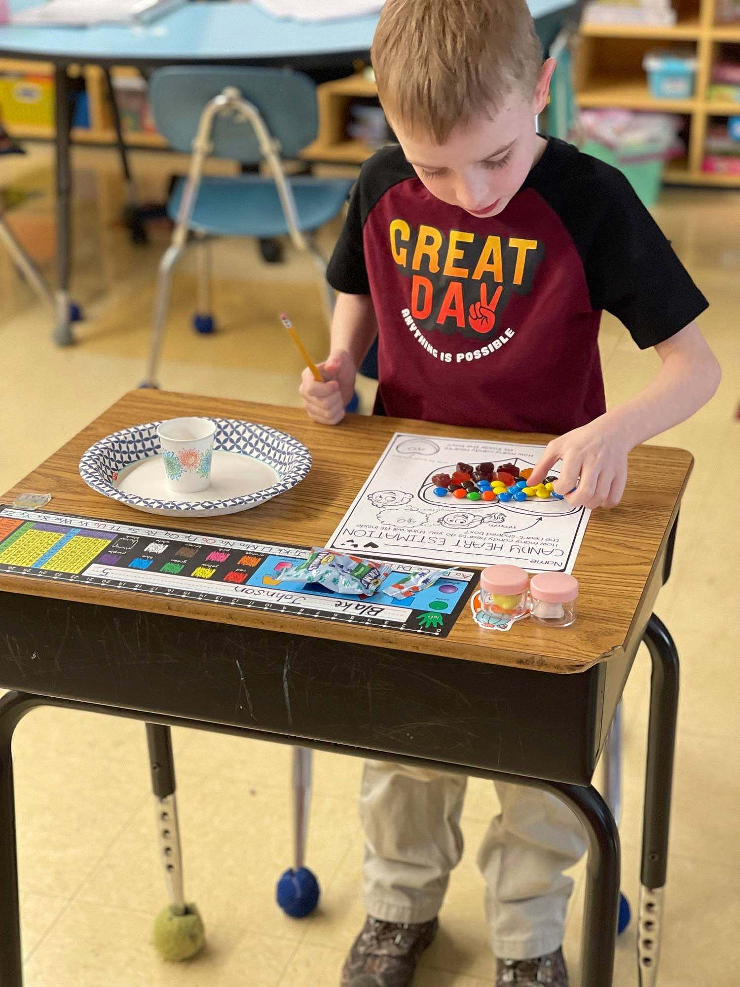 Blake joined the competition — help win amazing prizes! art, chair, child, community, competition_event, desk, engineering, fun, furniture, hand, indoor_games_and_sports, leisure, person, recreation, room, sharing, t_shirt, table, toddler, visual_arts