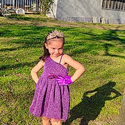 Jaylee is registered to the contest to win money with this photo: child, confident, dress, girl, glove, grass, house, outdoor, playful, portrait, posing, purple, shadow, shoes, smile, socks, sunlight, tiara, tree, yard