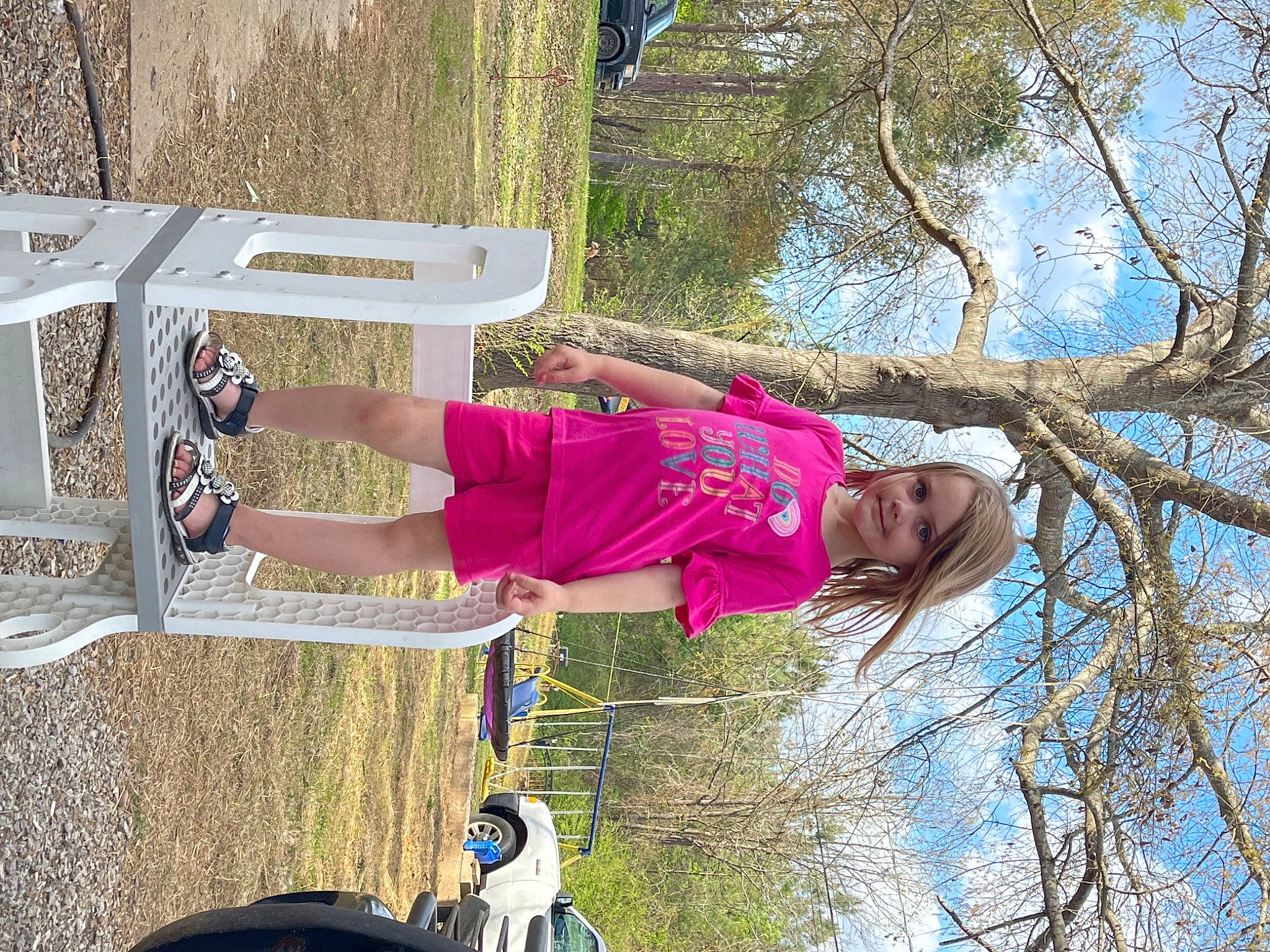 Alyson is registered to the contest to win money with this photo: fun, grass, joy, landscape, leisure, magenta, people_in_nature, person, plant, recreation, sky, smile, tire, tree, twig, walking_shoe, wheel, woody_plant