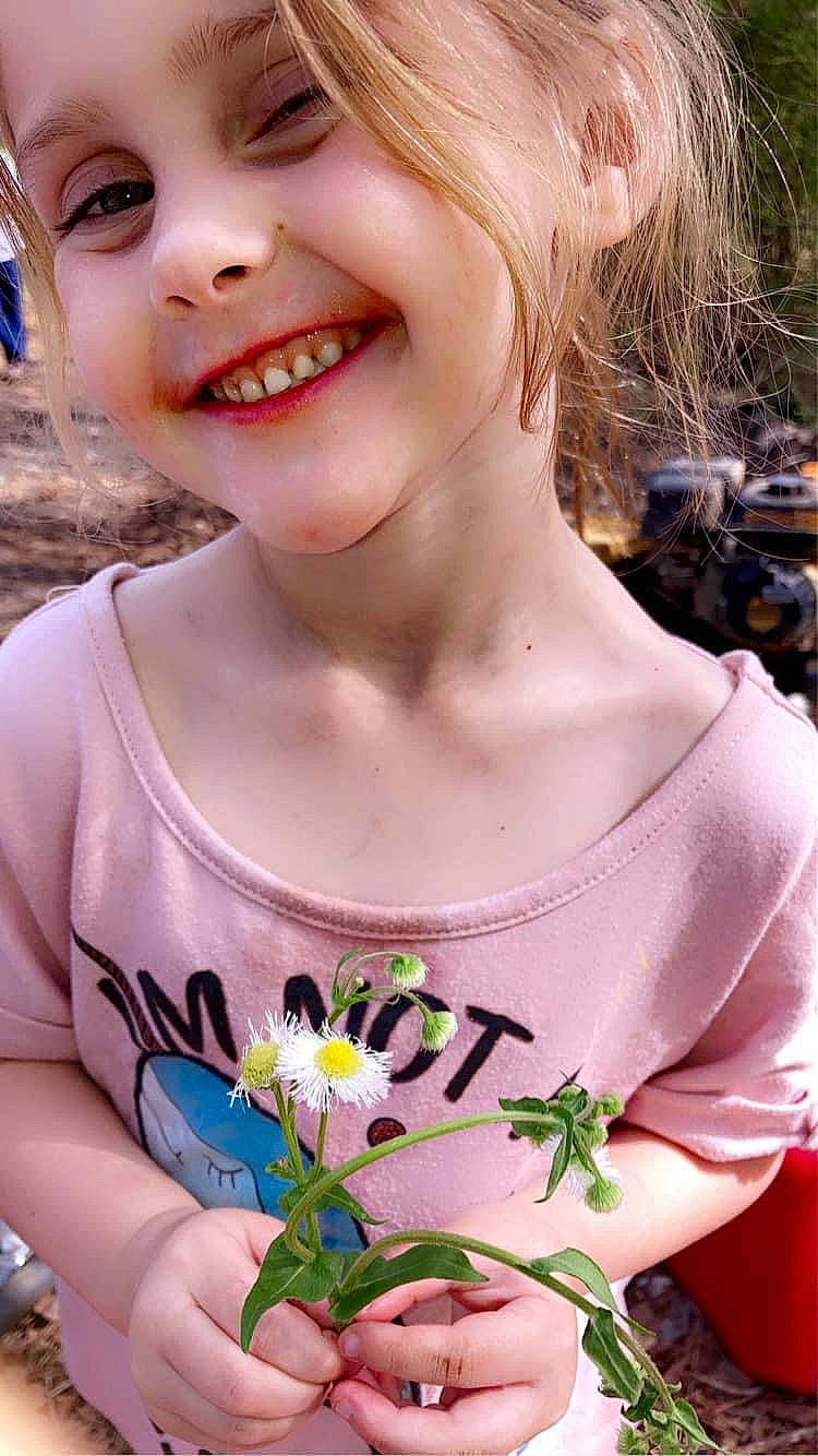 Alyson is registered to the contest to win money with this photo: beauty, eyelash, eyewear, flower, grass, hair, happy, iris, joy, lip, long_hair, neck, organ, people_in_nature, person, pink, plant, shoulder, skin, smile