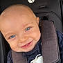 baby, smiling, blue_eyes, car_seat, safety_harness, child, close_up, face, infant, clothing, seatbelt, cute, young_child, portrait, happy, baby_boy, indoor, person, sitting, sweater