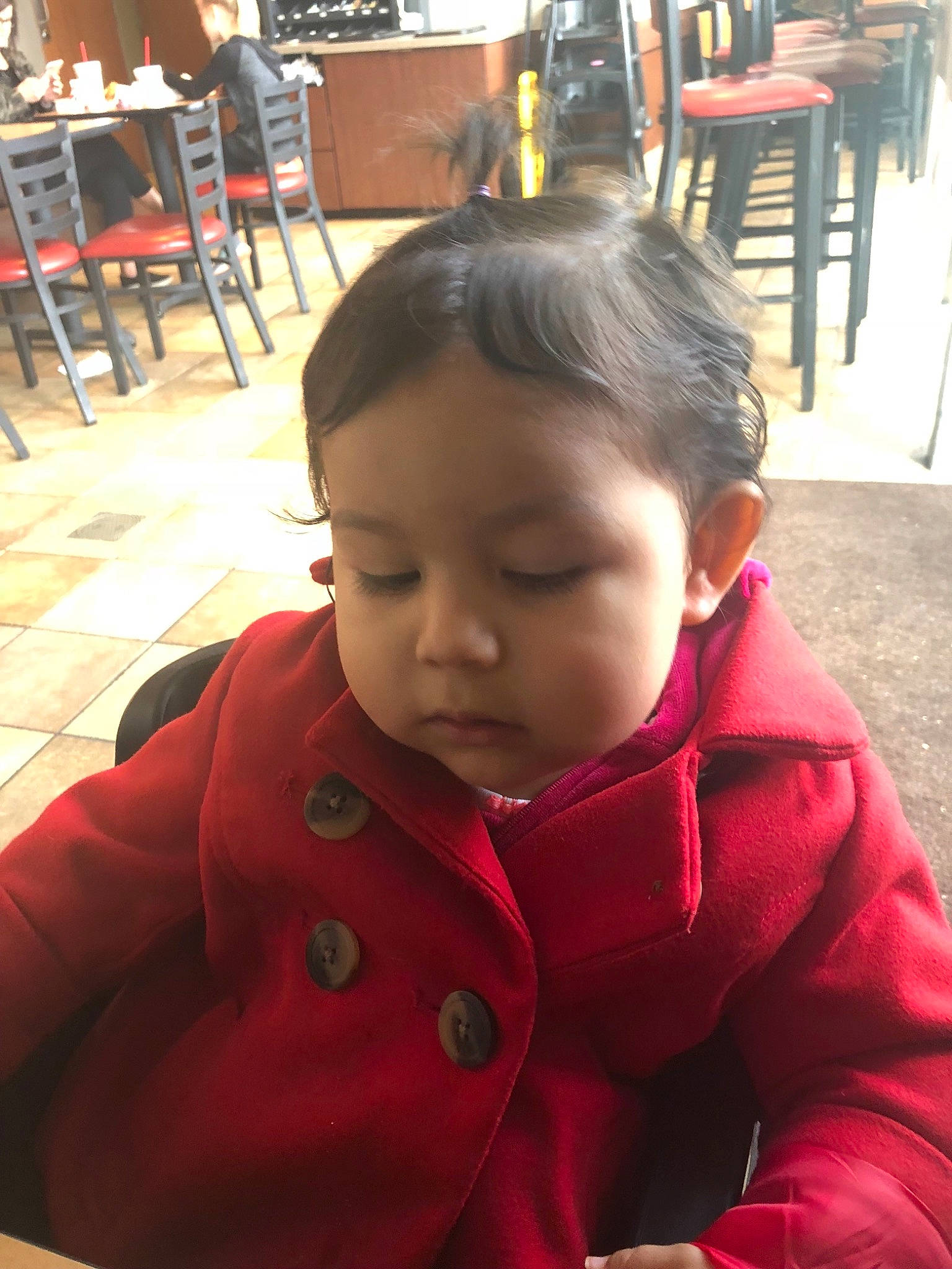 Emma is registered to the contest to win money with this photo: baby, cheek, child, ear, electronic_device, face, forehead, hair, head, neck, nose, outerwear, person, play, skin, smile, toddler, vacation