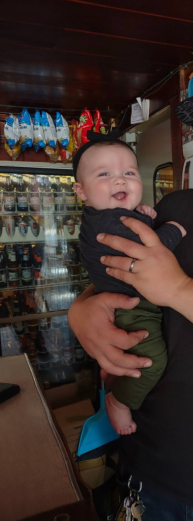 Hazel joined the competition — help win amazing prizes! baby, baby_toddler_clothing, child, collection, customer, finger, fun, gesture, hand, nail, person, retail, room, shelf, shelving, sitting, smile, thumb, toddler, toy