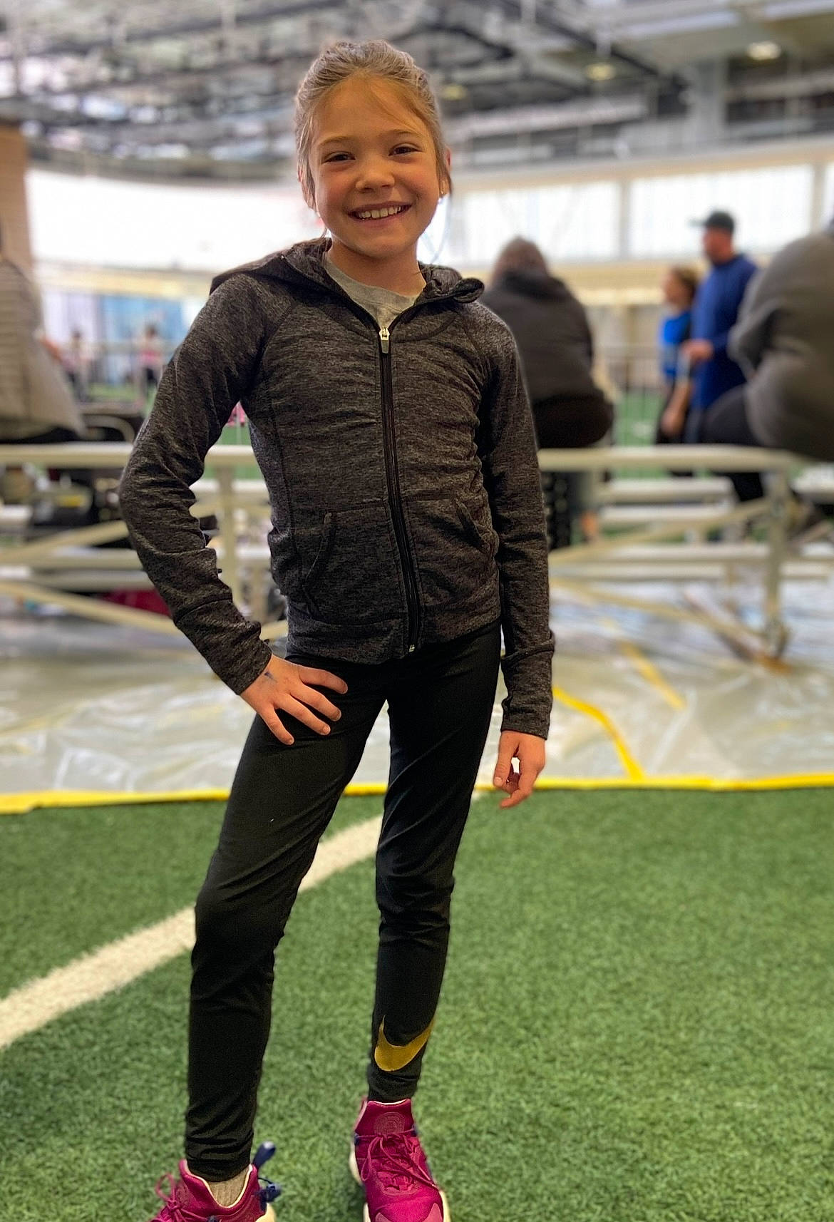 Laynie is registered to the contest to win money with this photo: artificial_turf, championship, competition_event, electric_blue, event, flooring, formal_wear, fun, grass, joy, knee, leisure, person, player, recreation, sleeve, smile, sports, sportswear, sweatpant