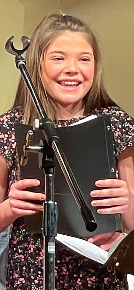 Laynie is registered to the contest to win money with this photo: audio_equipment, clarinetist, classical_music, entertainment, event, happy, joy, makeover, microphone_stand, music, music_artist, musical_instrument, musician, performance, person, recital, singer, singing, smile, violin_family