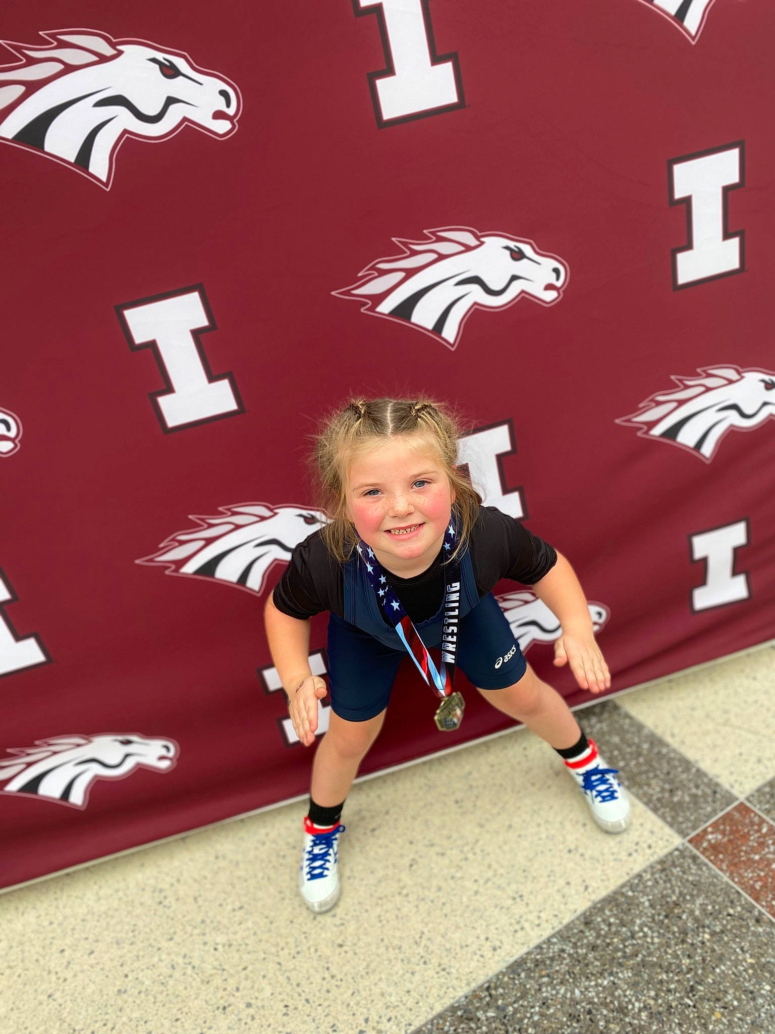 Beckett is registered to the contest to win money with this photo: carmine, child, event, flooring, font, graphics, happy, human_leg, joy, knee, logo, person, player, red, shorts, smile, sports_uniform, sportswear, style, t_shirt