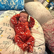 Easton joined the competition — help win amazing prizes! newborn, baby, sleeping, onesie, orange_clothing, animal_print, pillow, text_print, blanket, bed, cozy, indoor, infant, peaceful, resting, soft_furniture, cute, child, portrait, comfort