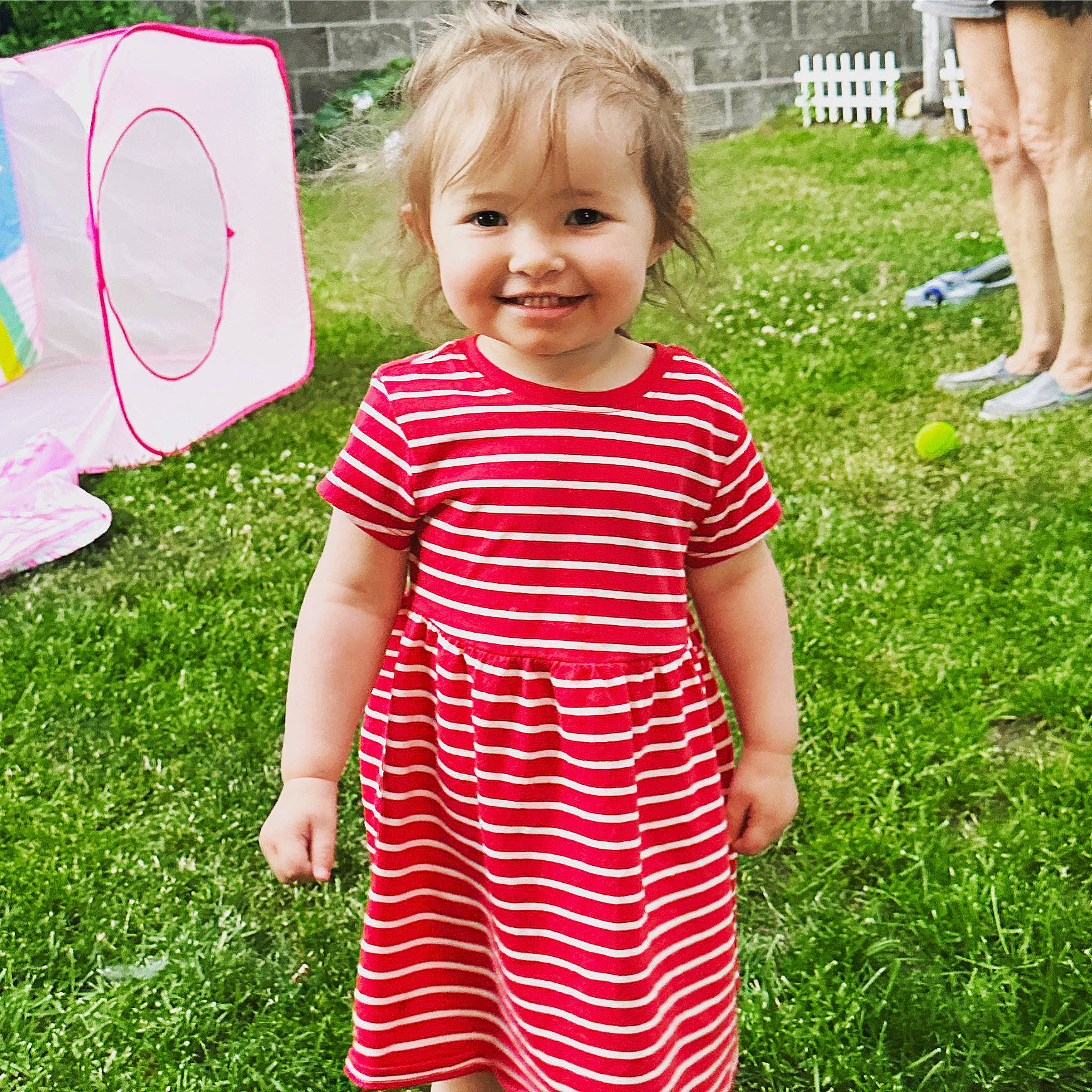 Iva is registered to the contest to win money with this photo: baby_toddler_clothing, blond, child, day_dress, fun, grass, green, happy, joy, lawn, one_piece_garment, pattern, people_in_nature, person, pink, plant, recreation, shorts, smile, t_shirt