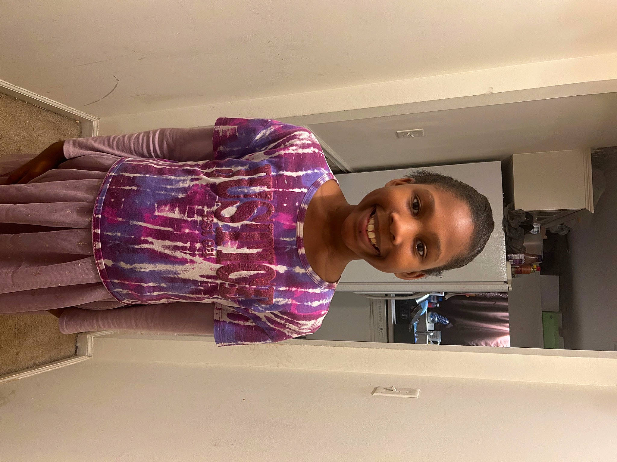 Ciara joined the competition — help win amazing prizes! ceiling, comfort, elbow, fashion_design, flooring, fun, happy, human_leg, joy, magenta, pattern, person, purple, room, sleeve, smile, t_shirt, thigh, tints_and_shades, waist