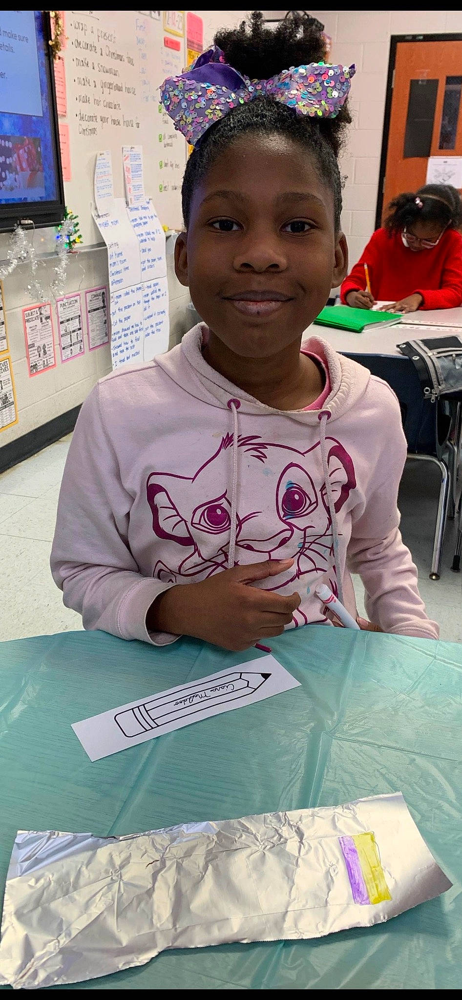 Ciara joined the competition — help win amazing prizes! adaptation, chair, child, community, display_device, education, event, fun, green, hairstyle, human, job, joy, learning, necklace, person, recreation, room, smile, t_shirt