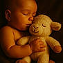 Ella a rejoint le concours — aidez-le/la à gagner de superbes lots ! baby, sleeping, stuffed_toy, lamb, plush, child, peaceful, cozy, soft, cute, infant, toddler, hand, face, closed_eyes, skin, warm_lighting, brown_background, cuddle, comfort
