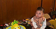 Jayden joined the competition — help win amazing prizes! baby, birthday, birthday_cake, cake, child, colorful, celebration, dessert, frosting, food, indoors, infant, party, portrait, seated, smiling, table, toy_character, wood_paneling, cake_decorations