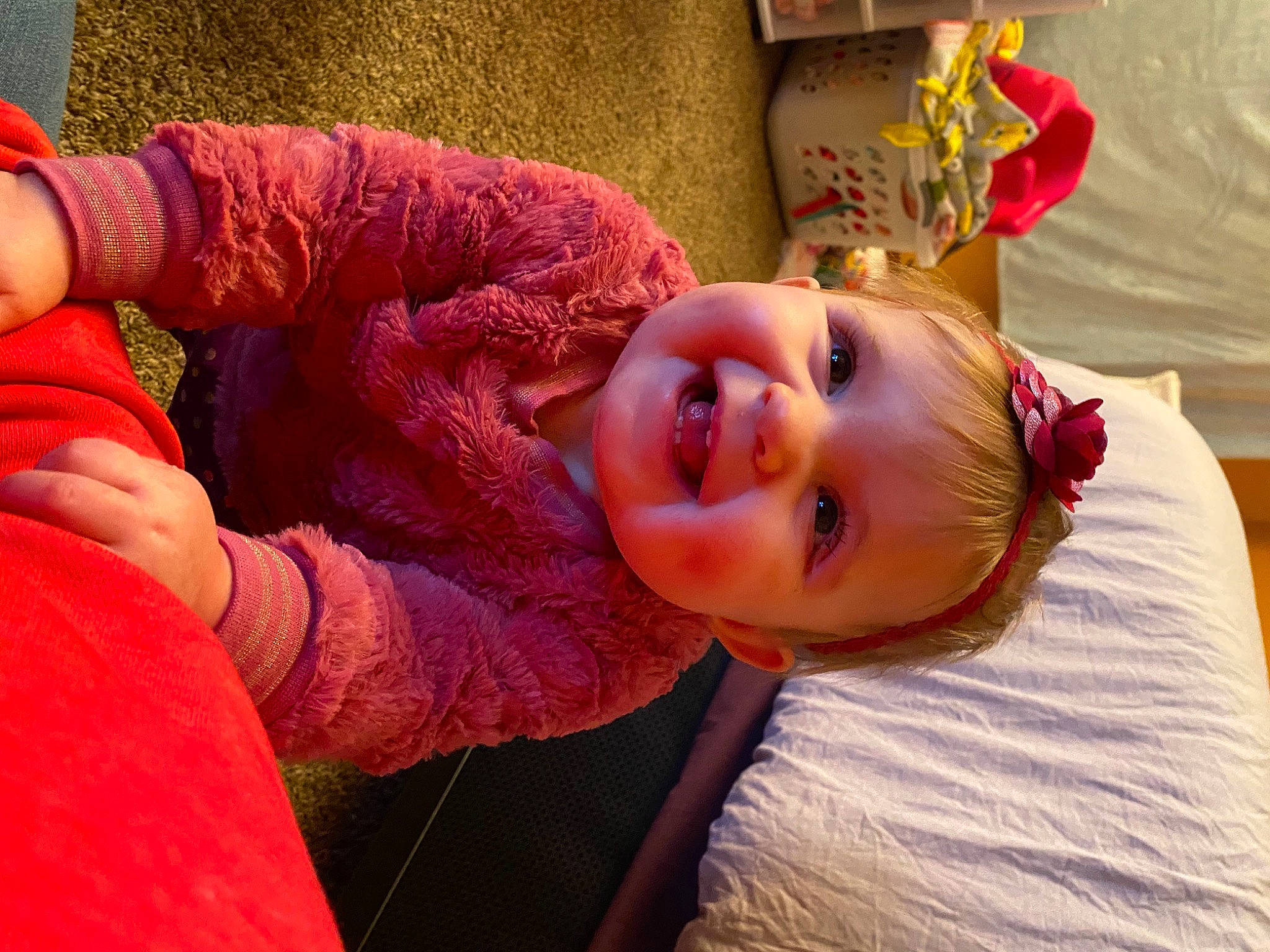 Presley is registered to the contest to win money with this photo: baby, child, eye, fun, gesture, happy, hat, head, joy, magenta, mouth, nose, orange, person, pink, room, skin, smile, thumb, toddler