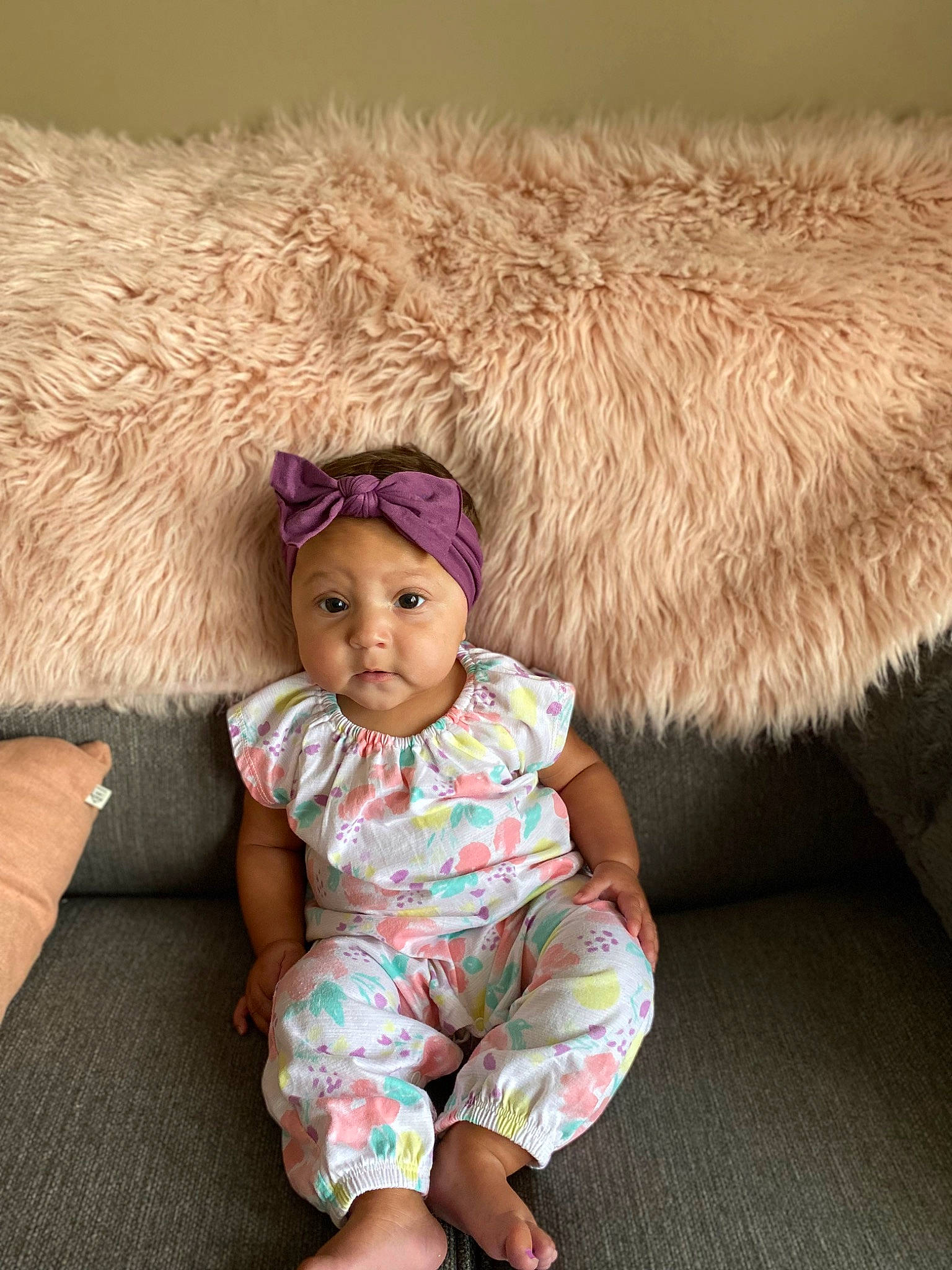 Syrah joined the competition — help win amazing prizes! baby, baby_toddler_clothing, cap, child, comfort, couch, fashion_accessory, fawn, hat, head, headwear, jacket, leg, linens, magenta, person, pink, sitting, skin, sleeve