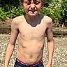 boy, casual, child, daylight, face, greenery, hair, happy, nature, outdoor, person, portrait, rocks, shirtless, shorts, skin, smile, summer, sunlight, young