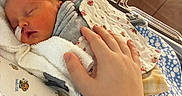 Eleanor joined the competition — help win amazing prizes! newborn, baby, sleeping, hospital, crib, blanket, hand, infant, bed, comfort, patient, medical, care, peaceful, wrapped, soft, tenderness, child, resting, cute