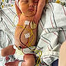 newborn, baby, infant, sleeping, medical_wires, diaper, hospital, blanket, striped, floral, monitoring, peaceful, cute, patient, healthcare, resting, wearing_hat, skin, lying_down, tubes