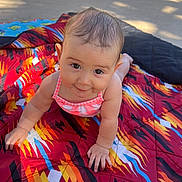 Madison is registered to the contest to win money with this photo: accessories, baby, blanket, clothing, crawling, cushion, dress, face, furniture, head, homedecor, outdoors, person, photography, portrait, quilt, sitting, summer, swimwear, towel