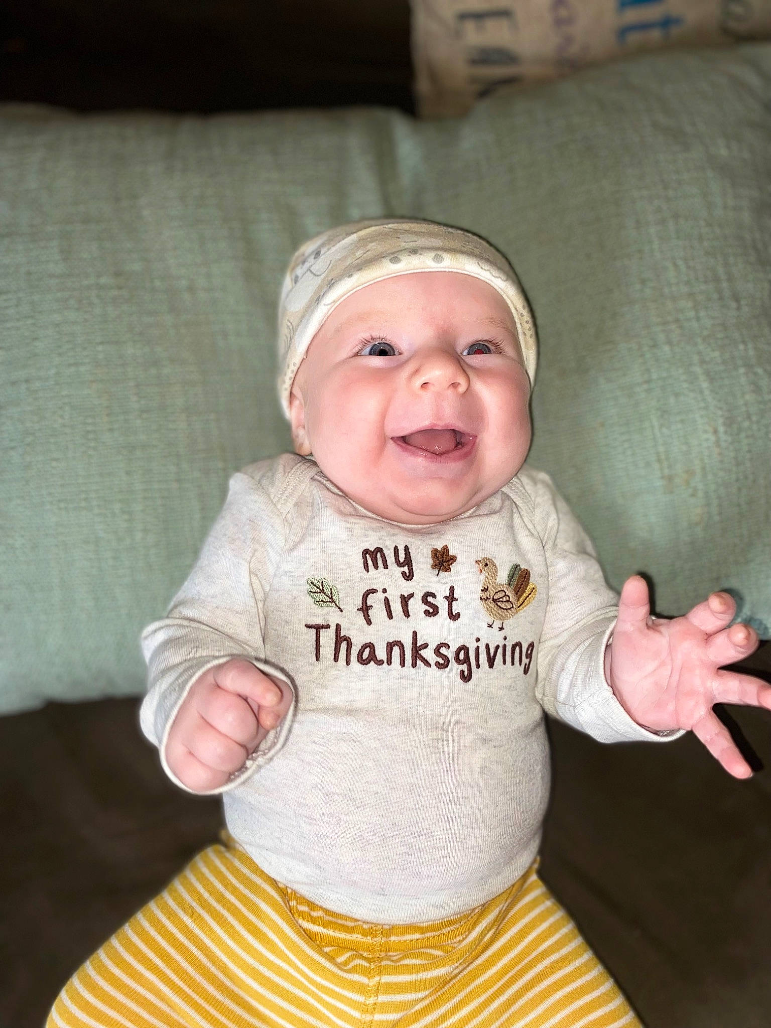 Chandler joined the competition — help win amazing prizes! baby, baby_products, baby_toddler_clothing, bib, cap, cheek, child, comfort, happy, hat, headwear, linens, pattern, person, sitting, sleeve, smile, t_shirt, textile, toddler