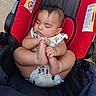 baby, sleeping, stroller, red, black, onesie, infant, child, cute, peaceful, hand, foot, outdoor, cartoon_print, seat, rest, skin, head, closed_eyes, young