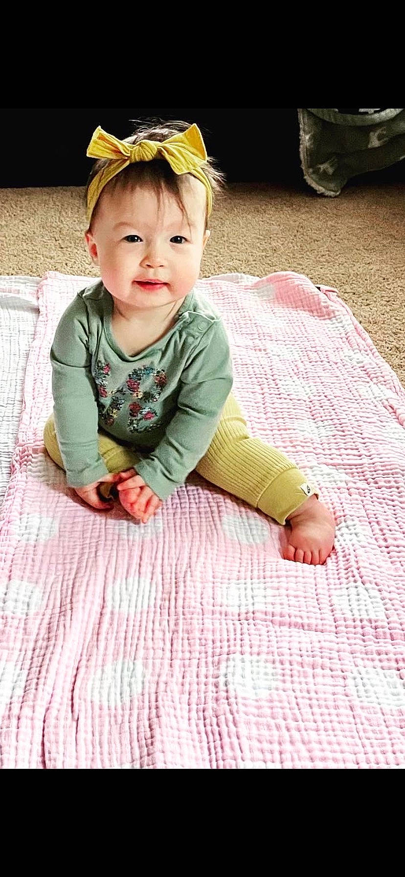 Aubriella is registered to the contest to win money with this photo: baby, baby_toddler_clothing, cap, cheek, child, eye, face, facial_expression, floor, flooring, grass, happy, head, person, photograph, skin, sleeve, smile, snapshot, toddler