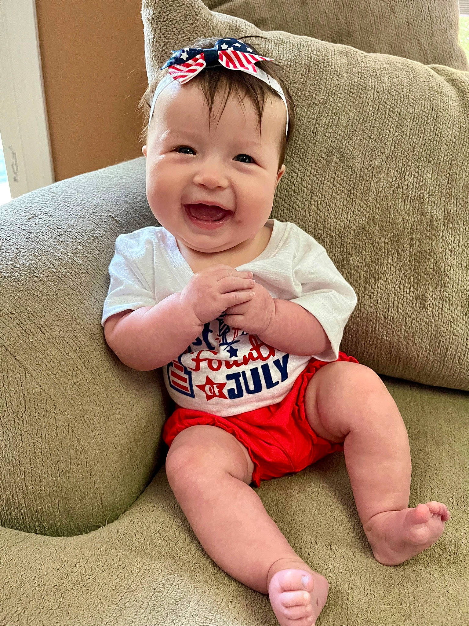 Aubriella is registered to the contest to win money with this photo: arm, baby, baby_laughing, baby_toddler_clothing, cap, child, comfort, costume_hat, eye, foot, happy, head, human_body, human_leg, joy, knee, person, skin, sleeve, smile