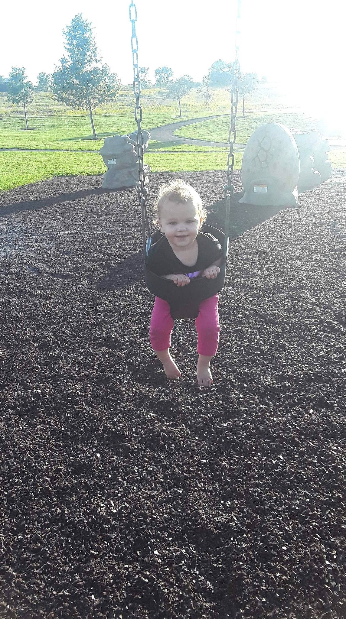 Lillyanna joined the competition — help win amazing prizes! child, fun, grass, joy, outdoor_play_equipment, person, plant, play, sky, soil, swing, toddler, tree, vacation