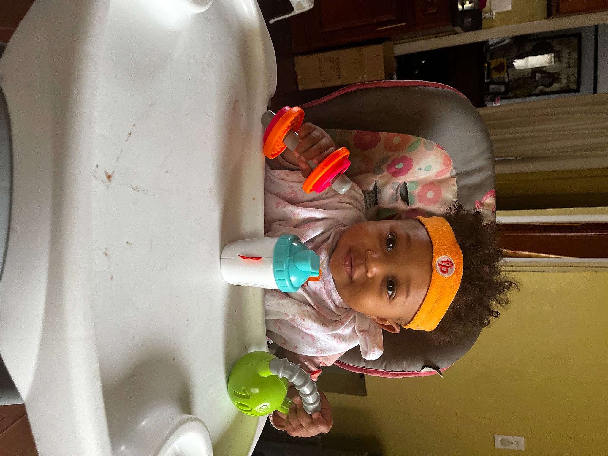 Blessyn is registered to the contest to win money with this photo: art, automotive_design, baby, child, circle, fun, hat, headwear, machine, person, plastic, room, smile, space, toddler