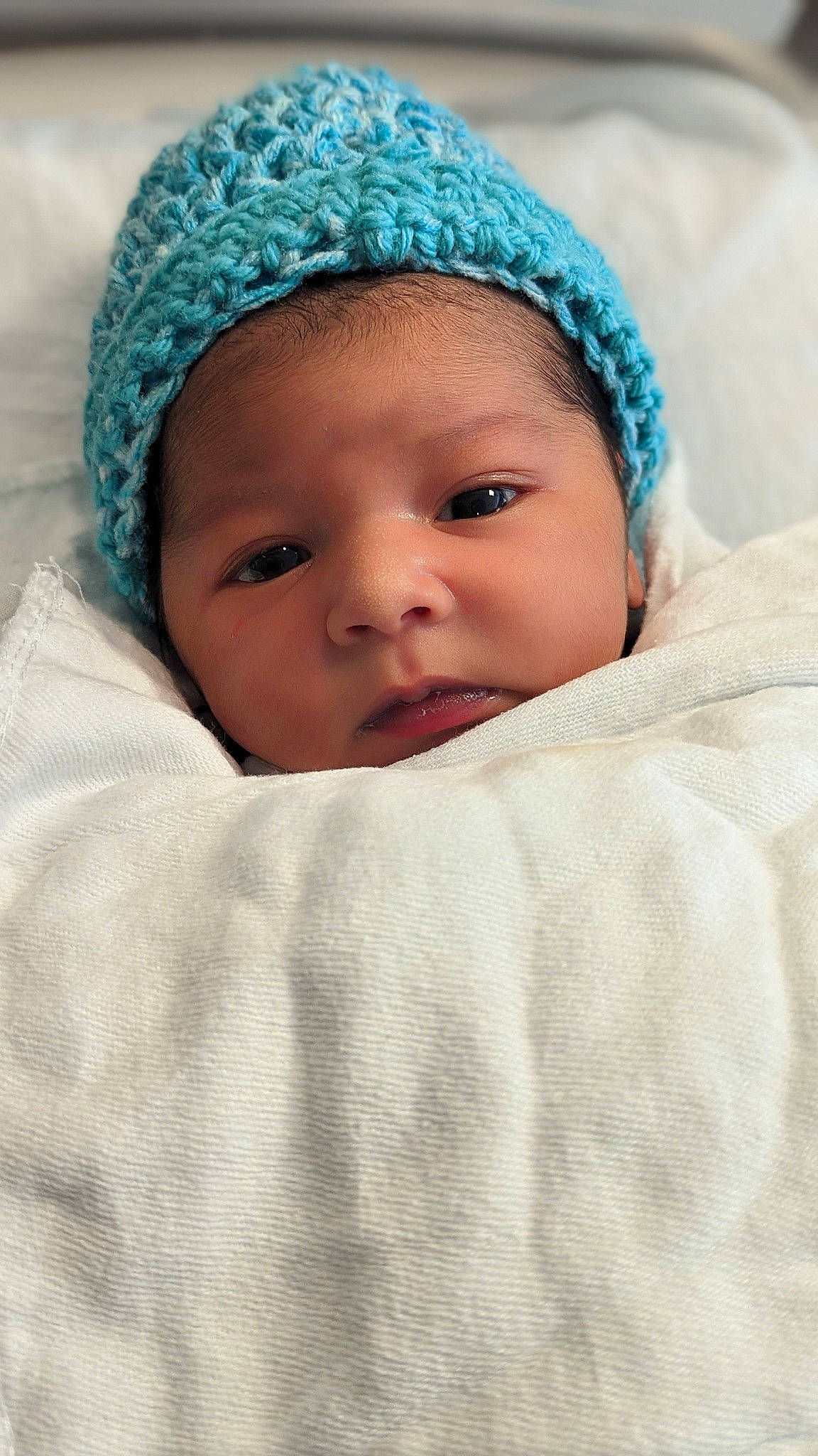 Justin is registered to the contest to win money with this photo: baby, baby_sleeping, beanie, cap, cheek, child, chin, comfort, eye, fashion_accessory, fur, happy, headgear, headwear, knit_cap, linens, person, portrait_photography, skin, toddler