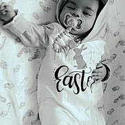 Kash is registered to the contest to win money with this photo: baby, infant, pacifier, sleeping, bunny_ears, onesie, blanket, footprints, cute, child, indoors, resting, sleepy, hat, easter, pattern, soft, cozy, lying_down, monochrome