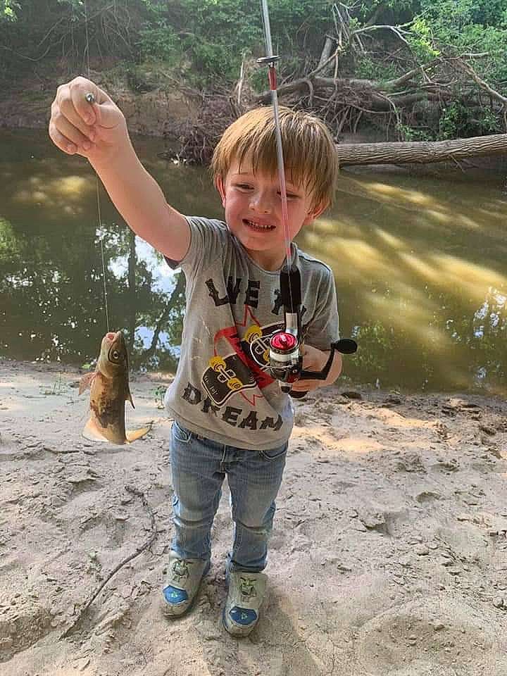 Hunter is registered to the contest to win money with this photo: child, fish, fishing, fishing_rod, joy, person, play, recreation, toddler, tree, vacation
