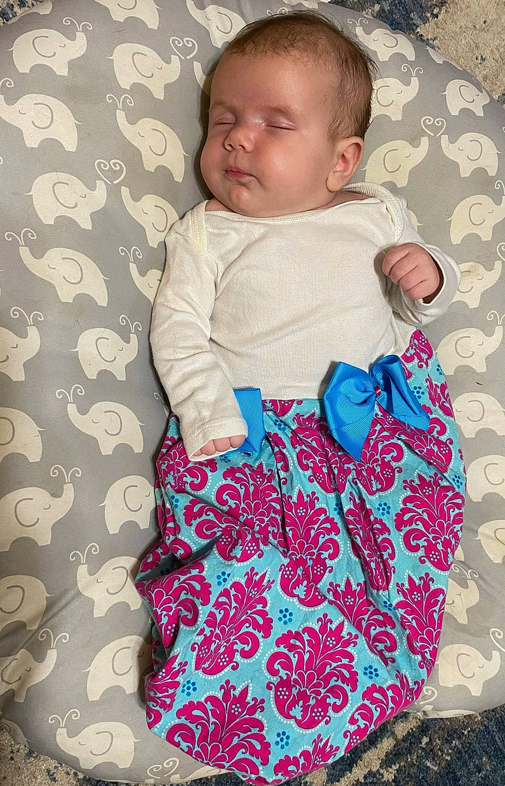 Felicitie joined the competition — help win amazing prizes! baby, baby_toddler_clothing, bag, bedding, child, comfort, design, electric_blue, facial_expression, happy, linens, luggage_and_bags, magenta, pattern, person, pink, sitting, sleeve, t_shirt, textile