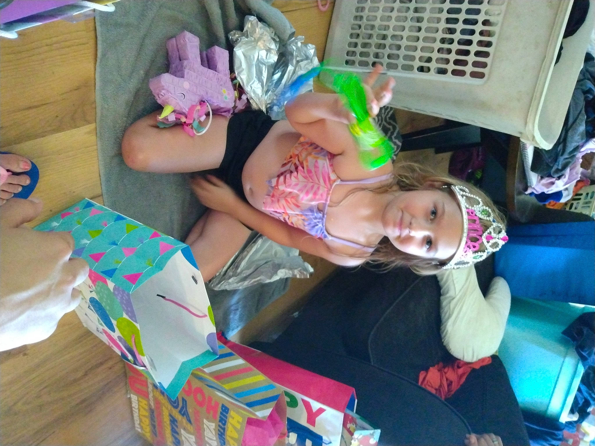 Blair is registered to the contest to win money with this photo: baby, baby_toddler_clothing, child, comfort, event, fun, hat, headwear, lap, leisure, party, pattern, person, pink, play, room, shorts, sitting, thigh, toddler